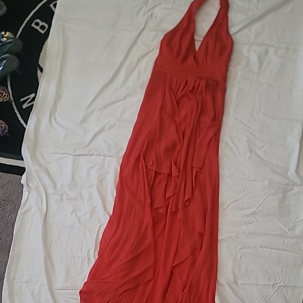 Nicole Miller gown with halter neckline. CORAL color